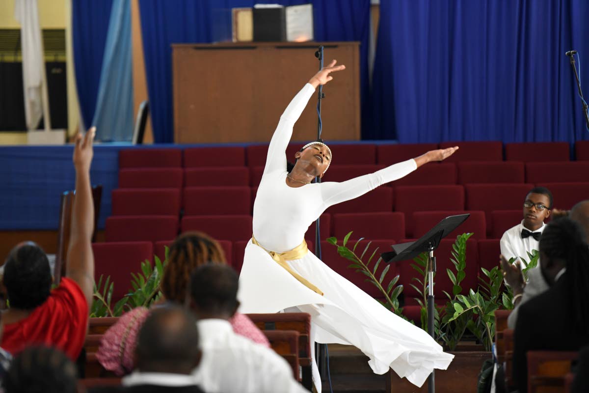 Amaya Lewis, family friend, delivers a dance piece at the funeral.