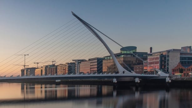 Samuel Beckett Bridge and The Convention Centre Dublin and IFSC House, Golden hour shoot time, beautiful sun and water reflections, Dublin, Ireland,