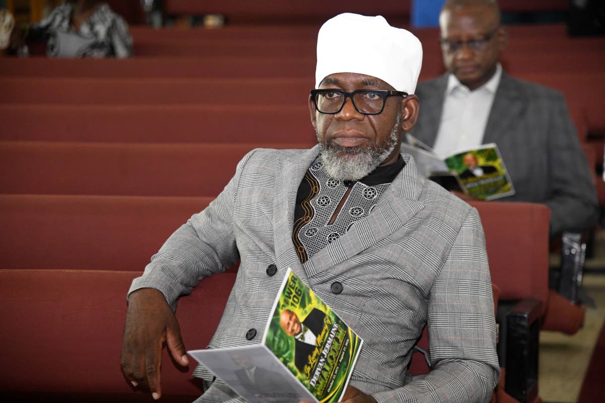 Journalist Garfield Angus at the funeral.